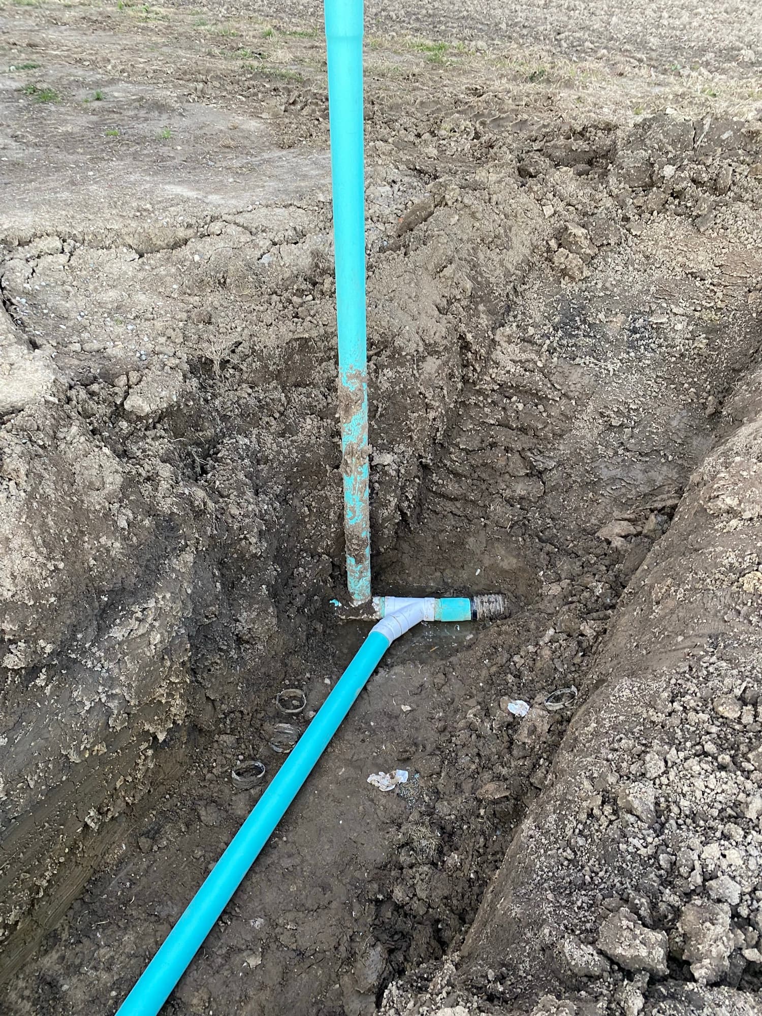 New water line laid in an open trench by Andrews Plumbing